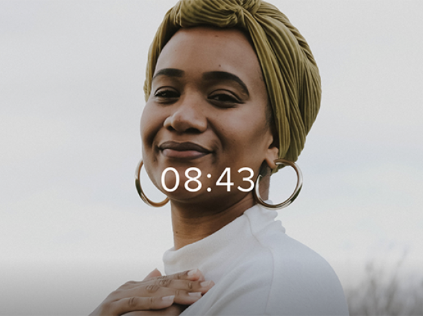 Smiling woman with hand on heart