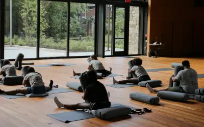 A group doing restorative yoga in the Contemplative Commons