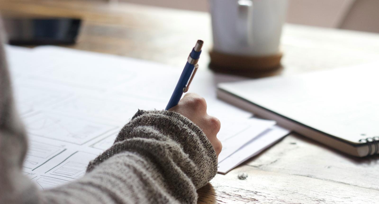 Person writing stock photo Unsplash