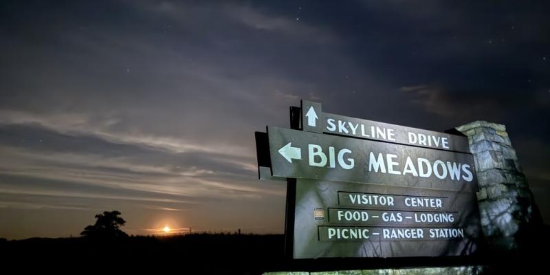 Sign for Big Meadow with the moonrise in the background