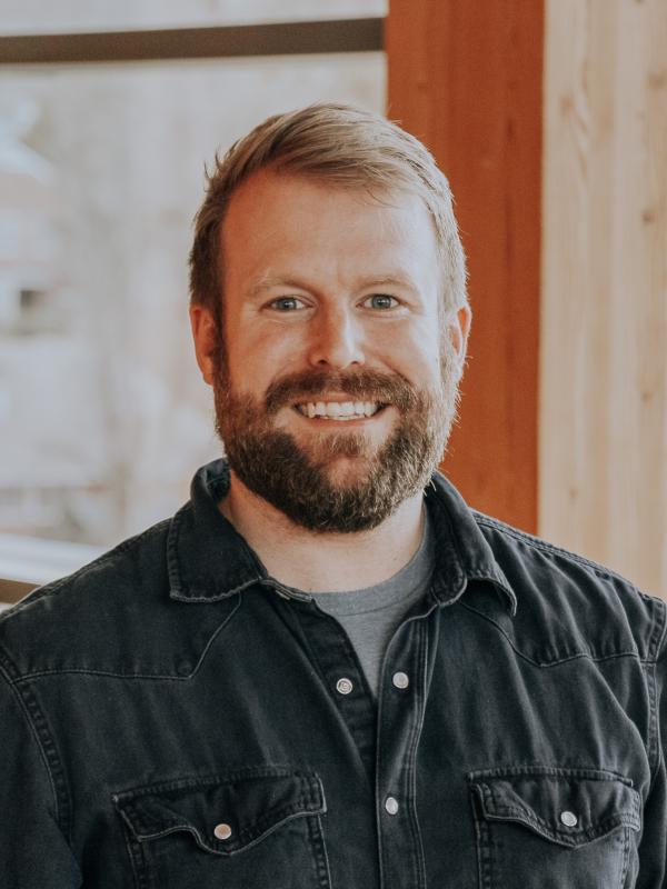 Sam Cole's headshot, taken inside of the Contemplative Commons