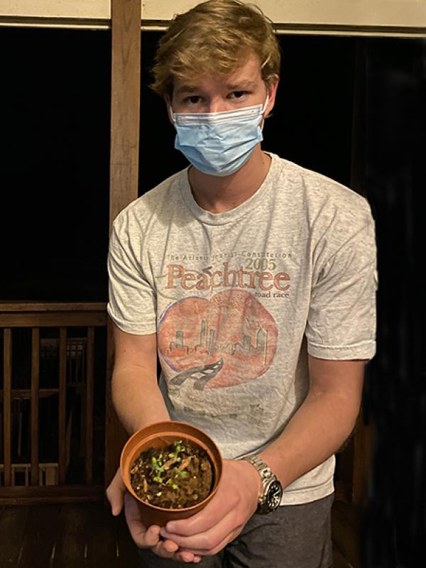 Jake Edwards show some seedlings.