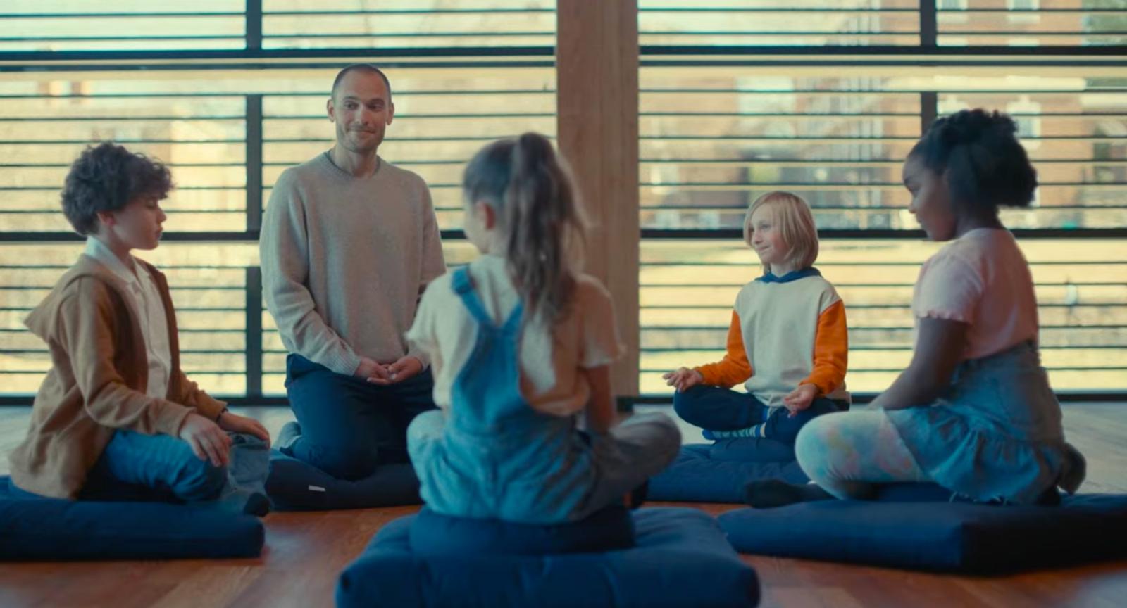 Circle of people one adult and four children from a CSC video