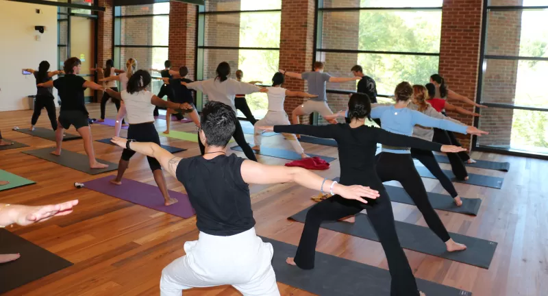Students participating in yoga class