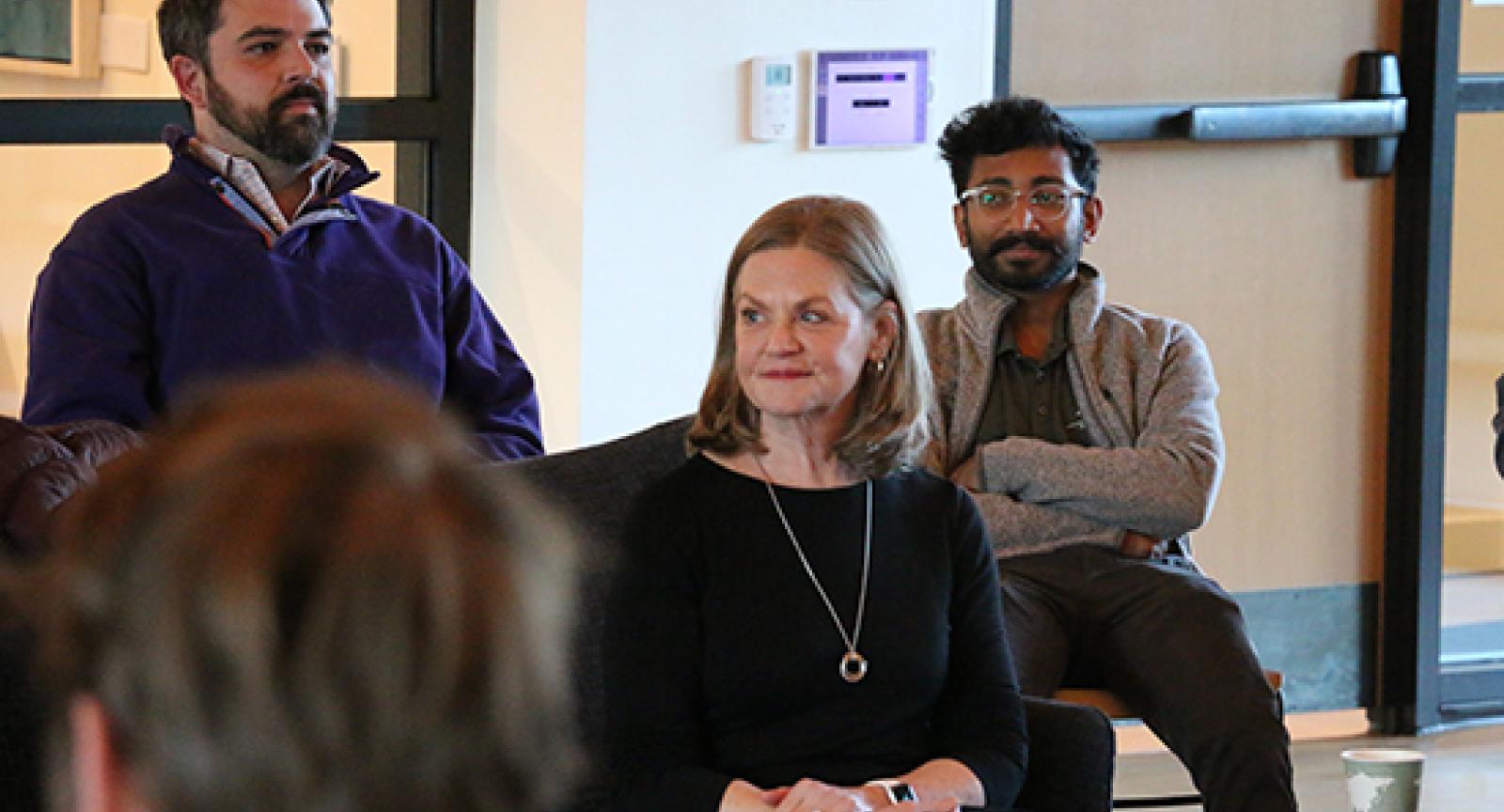 People sitting at a discussion, including Lili Powell 