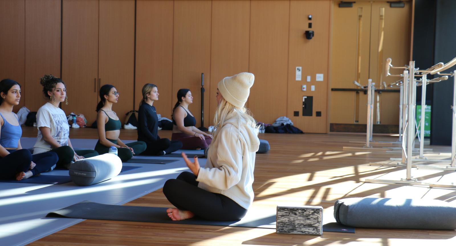 People meditating on mats