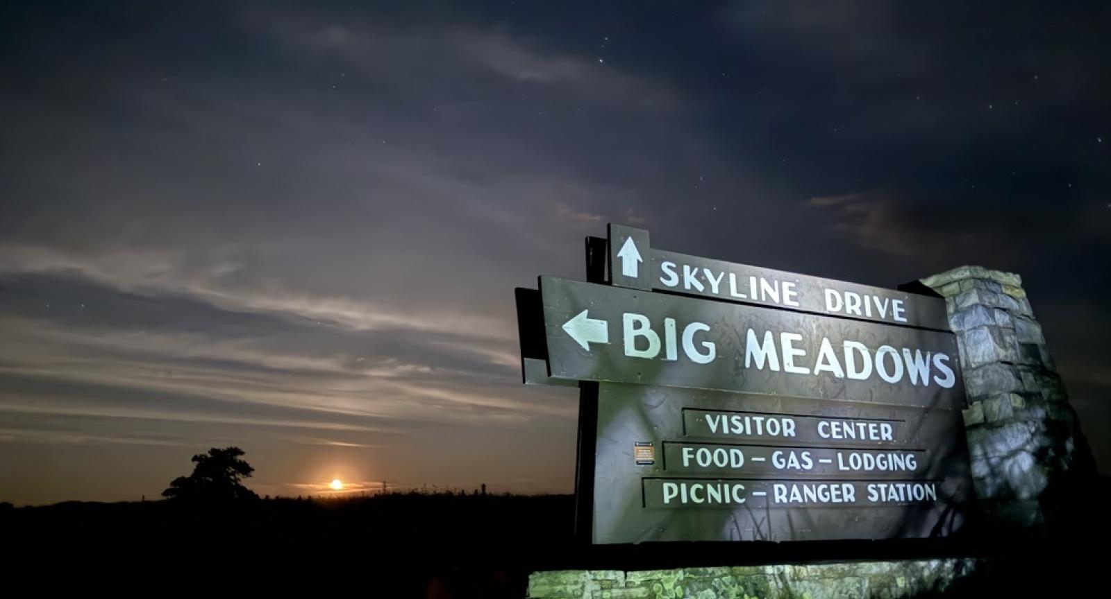 Sign for Big Meadow with the moonrise in the background