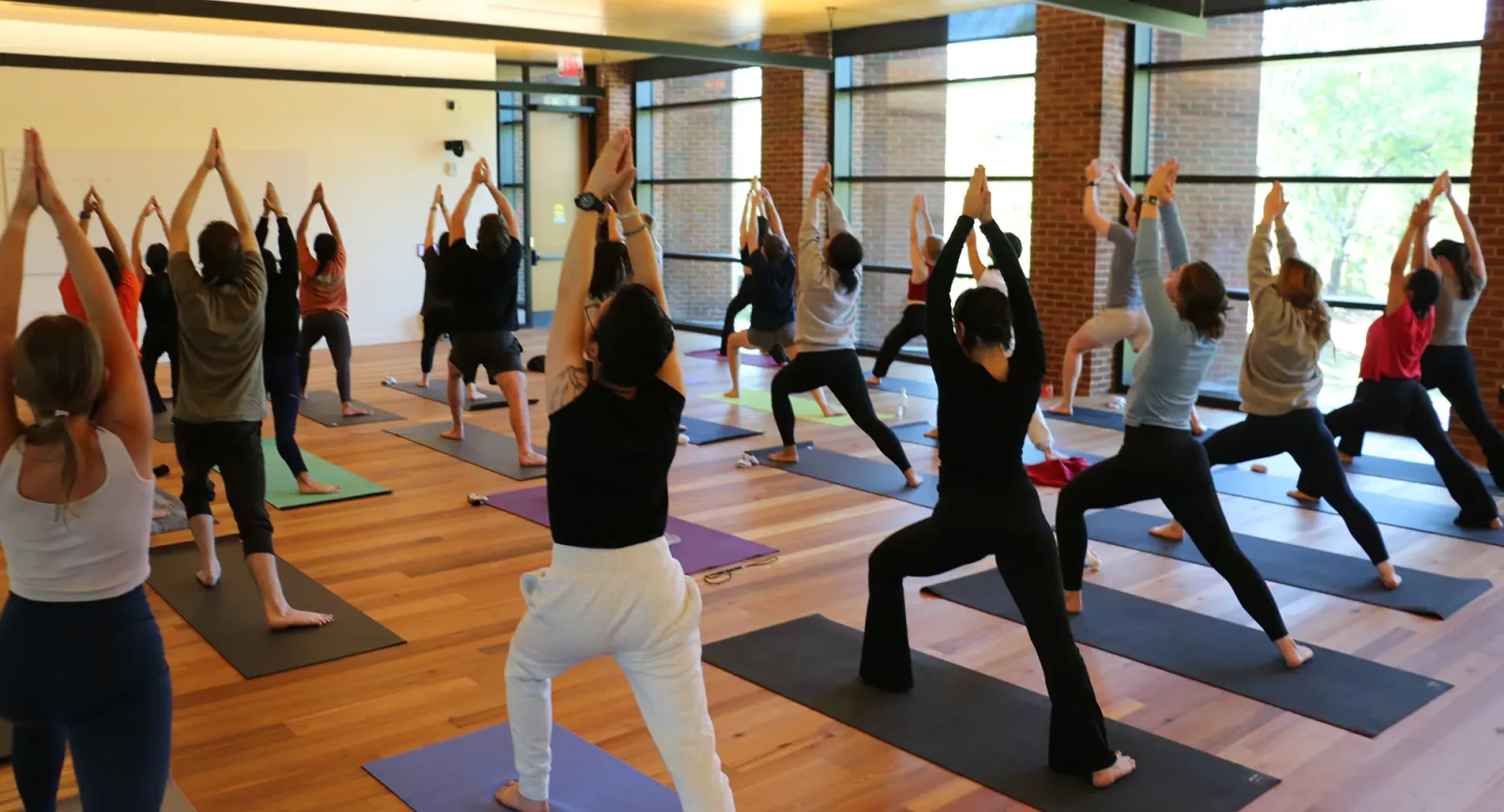 Students doing yoga in the Contemplative Commons
