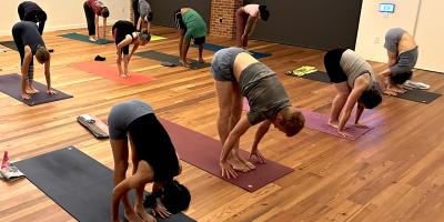 Yoga class touching toes
