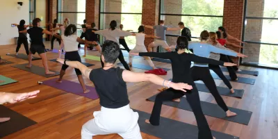 Students participating in yoga class
