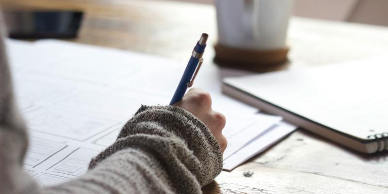 Person writing stock photo Unsplash