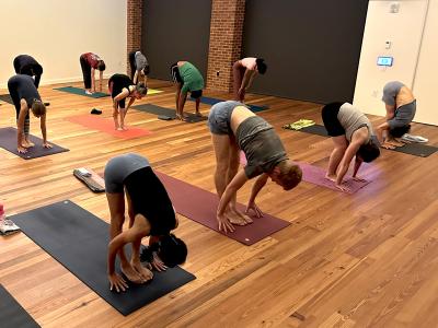 Yoga class touching toes