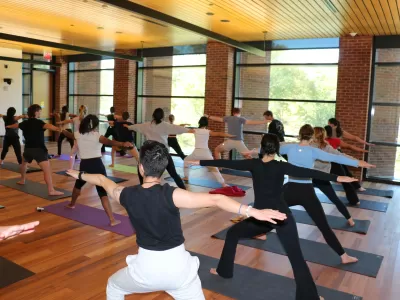 Students participating in yoga class