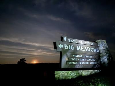 Sign for Big Meadow with the moonrise in the background