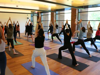 Students doing yoga in the Contemplative Commons